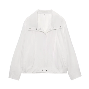 Flat lay of a minimalist white long sleeve bomber jacket and matching pleated trousers