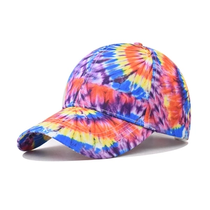 Detail of colorful tie-dye graffiti baseball cap with artistic swirl patterns and white stitching