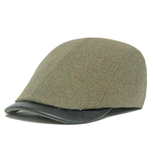 Winter wool newsboy cap in olive green tweed with a black leather visor for women