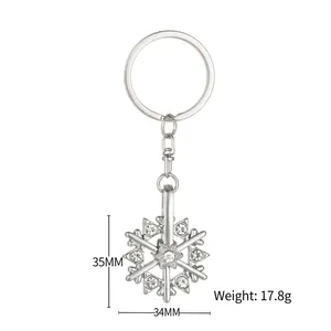 Rotating snowflake keychain with rhinestones, 35mm silver alloy bag charm pendant