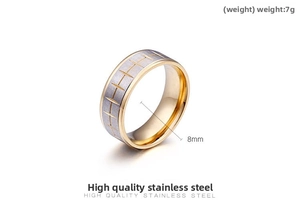 Detail of 8mm stainless steel ring featuring silver tire tread pattern and gold inner band