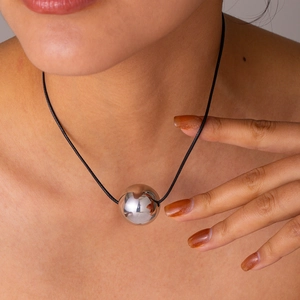 Minimalist silver steel ball pendant necklace with adjustable black wax rope on model