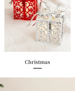 Christmas glowing hollow metal gift box decoration with warm light and silver bow.