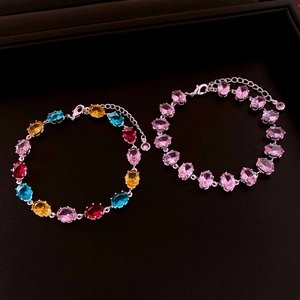 Close-up of luxury oval zircon bracelets with colorful gemstones and silver lobster clasp