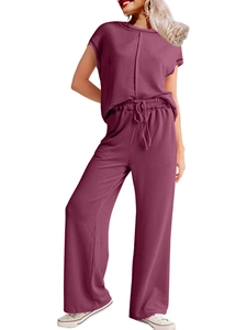 Detail of ribbed knit texture on mauve short sleeve top and wide leg pants set