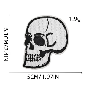 Close-up of black and white skull embroidery patch with size measurements 6.1cm x 5cm