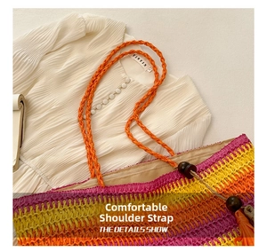 Detail of colorful striped straw bag featuring orange woven straps and wooden bead accents