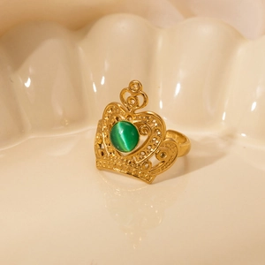 French luxury titanium crown ring with green gemstone and vintage gold finish detail