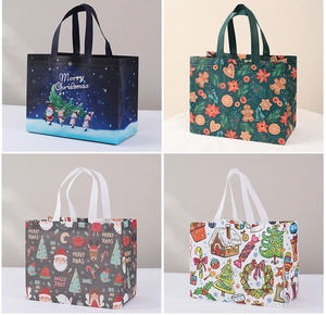 Detail showing four different Christmas non-woven gift bags with festive printed patterns