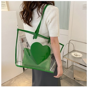 Detailed view of green transparent heart tote bag with matching inner pouch for women