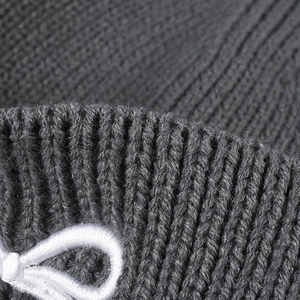Deep grey winter knit beanie with warm embroidery and premium ribbed texture detail