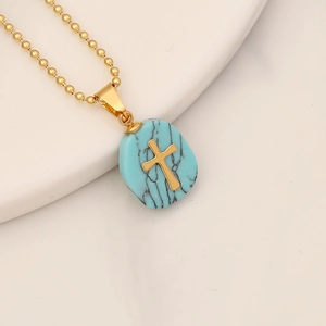Minimalist stainless steel gold chain necklace with a turquoise stone cross pendant