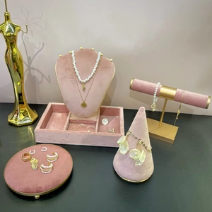 Pink velvet jewelry display set with gold metal stand for necklaces and bracelets
