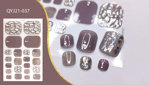 Detail of marble pattern and silver foil decoration on mauve summer toe nail wraps