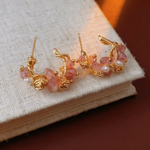 Elegant gold-plated C-shaped earrings with strawberry quartz pearls and rose details