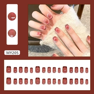 Cat eye press-on nails in deep burgundy red with sparkling rhinestones and square shape
