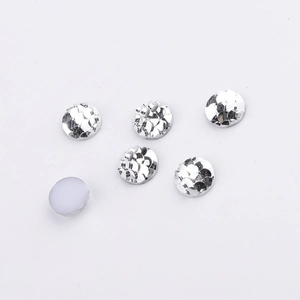 Macro shot of 8mm round silver fish scale resin rhinestones with smooth AB color finish