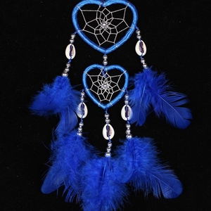 Blue double heart dream catcher with feathers and sea shells on a dark background