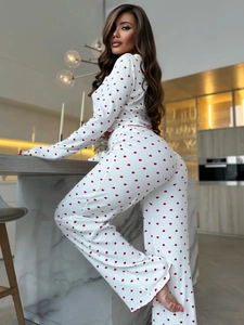 Detail of white knit loungewear with red heart print and ribbed texture fabric