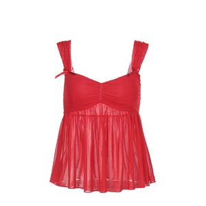 Detail of red mesh camisole top featuring delicate bow accents on the shoulder straps
