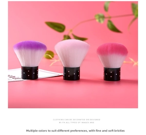 Three gradient nail dust brushes with black handles and silver rhinestone accents detail