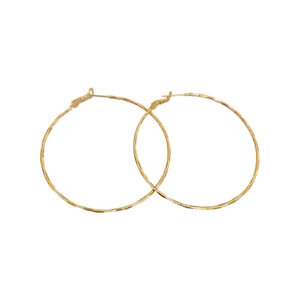 Large golden hammered metal hoop earrings with minimalist geometric design for women