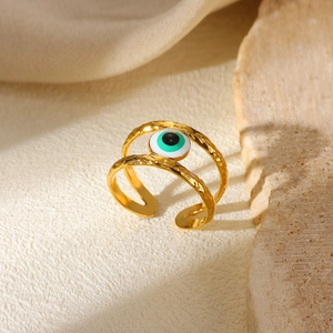 Adjustable gold stainless steel evil eye open ring featuring double bands and hammered finish