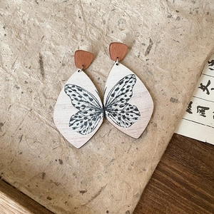 Vintage wood butterfly teardrop earrings with silver needles and ethnic design charms