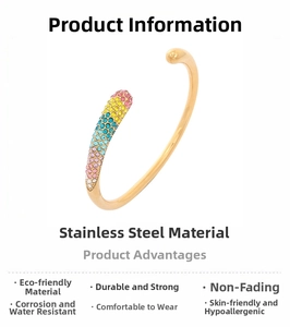 Detail view of gold stainless steel open bangle with colorful gradient rhinestones