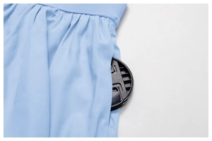Detail view of quick-dry tennis skirt with functional side pocket and pleated waist