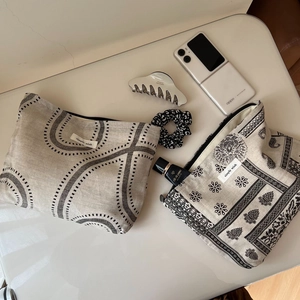 Vintage cotton linen printed cosmetic bags with geometric and bohemian patterns on table