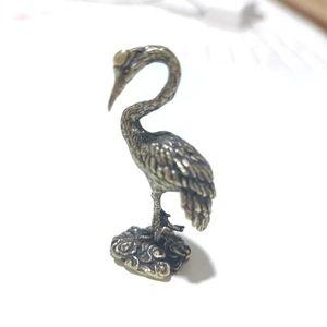 Vintage brass crane bird figurine for desk decoration with a traditional antique bronze finish