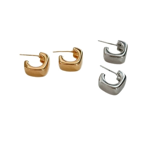 Polished square C-shaped stud earrings set in gold and silver finish on white background