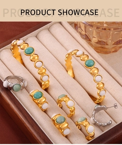 Detail of vintage bohemian jewelry set with turquoise and white beads in a velvet tray