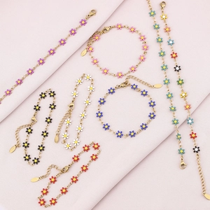Minimalist gold daisy bracelets with colorful enamel petals and adjustable lobster clasp