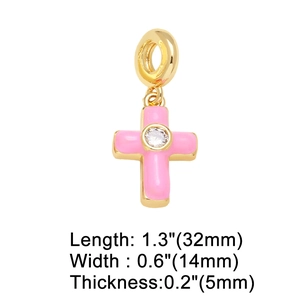 Pink enamel cross pendant detail with dimensions 32mm by 14mm on a white background