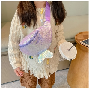 Close-up of a shimmering purple mermaid sequin crossbody bag worn by a child model