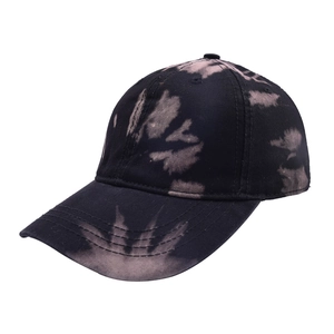 Detail view of tie-dye baseball cap with reinforced stitching and breathable eyelets