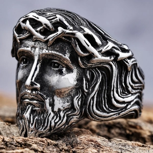 Detailed macro of vintage stainless steel ring with a carved relief of Jesus' head