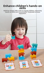 Close-up of a child stacking colorful bear-shaped wooden balancing blocks with task cards