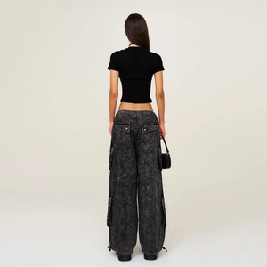 Back view of washed gray wide-leg cargo jeans for women with multi-pocket design