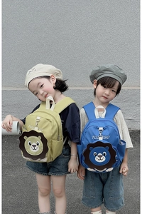Front view of cute 3D cartoon lion backpacks in yellow and blue colors for children