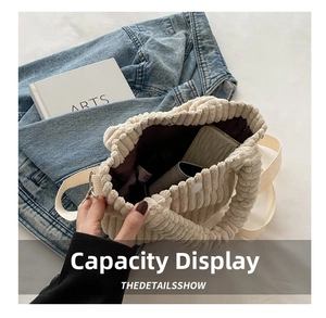 Detail view of corduroy bucket bag interior showing capacity for phone and accessories