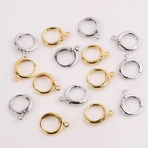 Detail of round gold and silver huggie earring hooks with loops for DIY jewelry making
