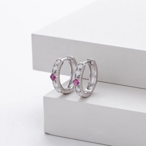 Detail of S925 sterling silver hoop earrings with red square zircon and white stones