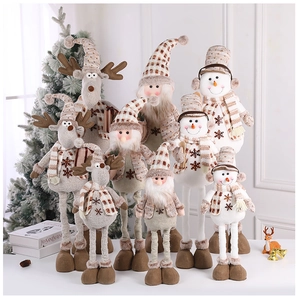 Close-up of knit fabric and faux fur details on festive Christmas reindeer and snowman plush