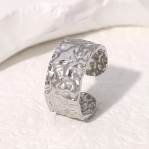 Minimalist silver stainless steel open ring featuring a unique irregular lava hammer texture