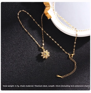 Close-up of golden titanium steel clover necklace with cubic zirconia and 45cm chain