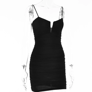 Close-up of black sexy V-neck bodycon dress with ruching detail and spaghetti straps