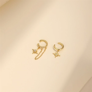 Detail of 925 sterling silver gold ear cuffs with star pendant and tassel chain detail